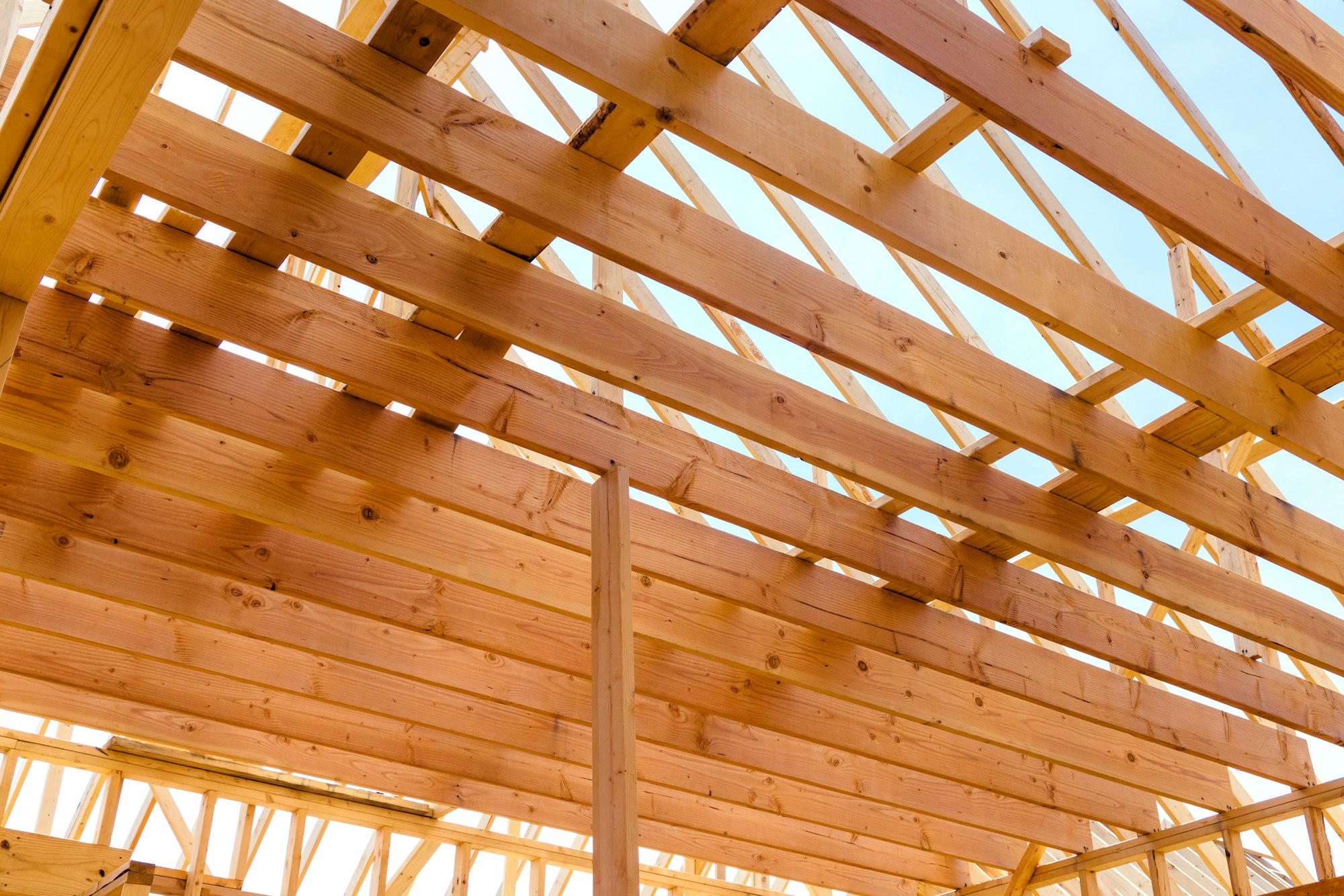 Construction of a new house. View of the wooden roof structure.